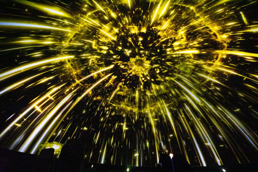 A rendering of yellow star burst projected onto a half-dome