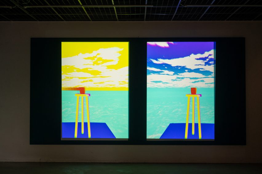 A digital projection of a graphic of a sea and sky