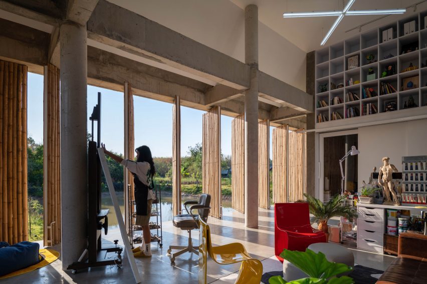 Interior of an artist's studio with rotating bamboo screens