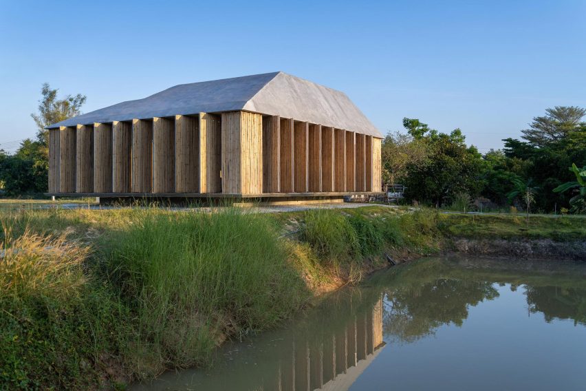 Furnish Studio by 11.29 Studio next to a pond