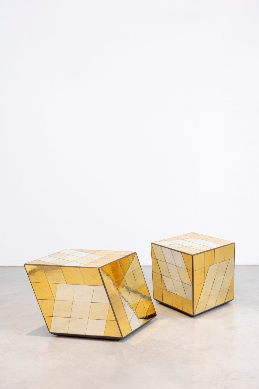 Reflective yellow tables at the Growth and Form exhibition at Gallery Fumi