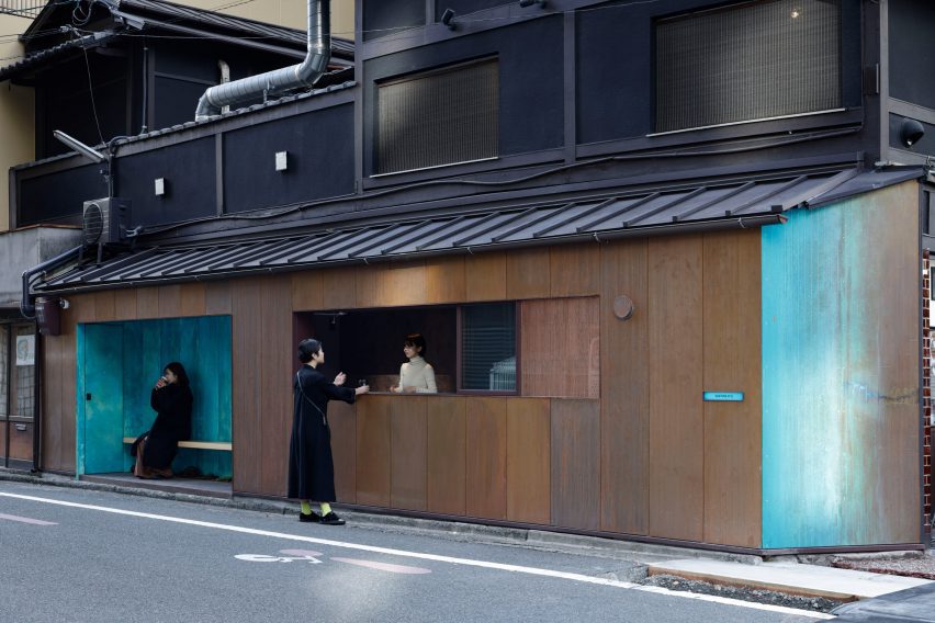 Seating and serving hatch in copper-clad kiosk in Kyoto by G Architects Studio