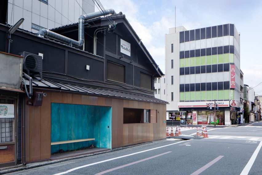 Recessed bench seating in a copper-clad coffee kiosk by G Architects Studio