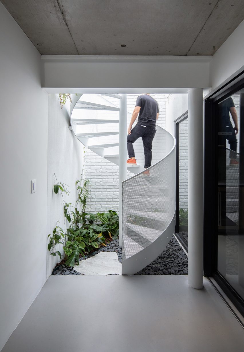White spiral staircase at Casa Yuji by Goiva