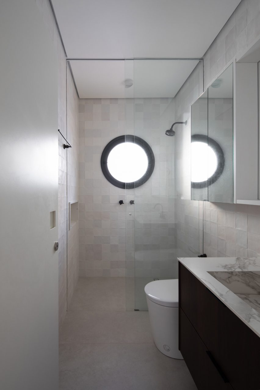 White bathroom with a circular window