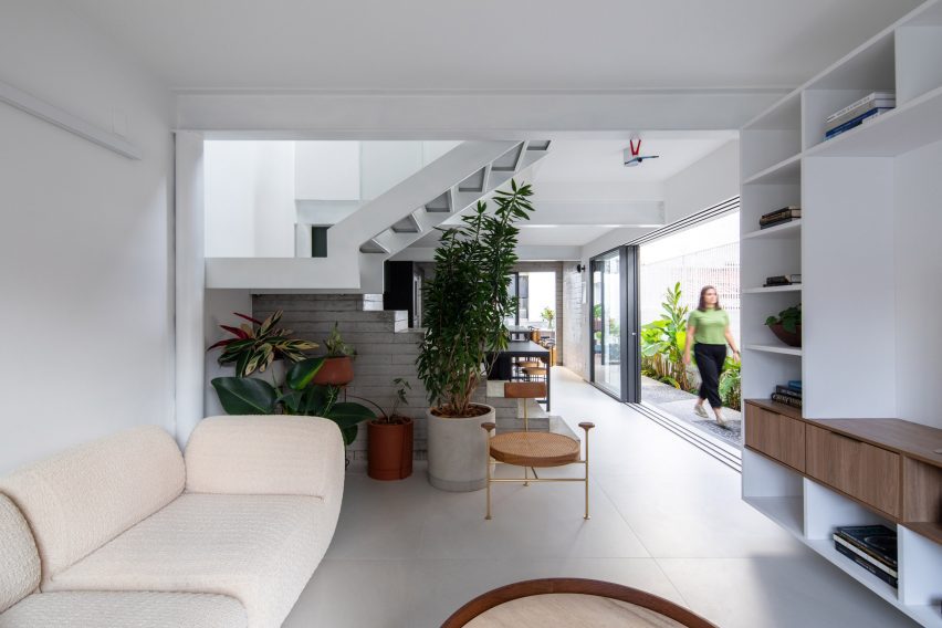 Open-plan living space at Casa Yuji in Sao Paulo by Goiva