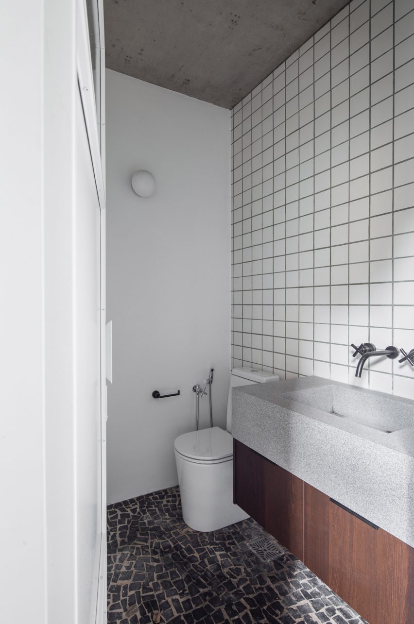 Bathroom with square white wall tiles