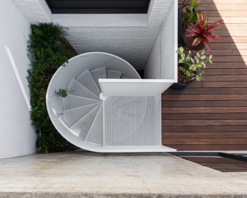 White spiral staircase and wood decking