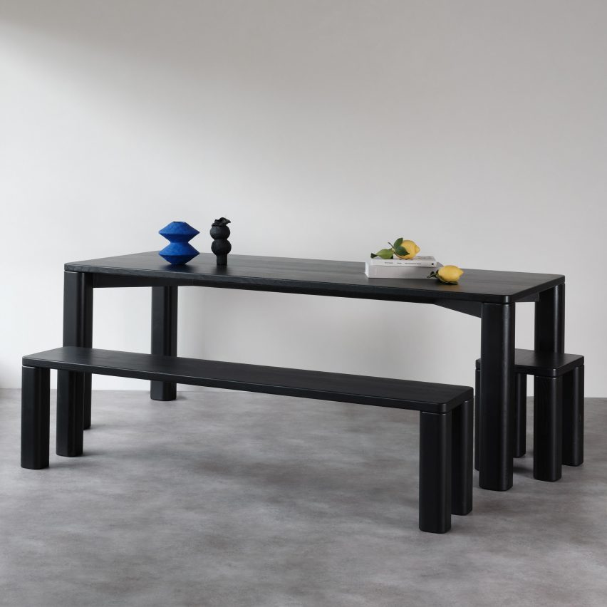 Black wooden dining table, benches and stools by Goldfinger and the Tate Modern