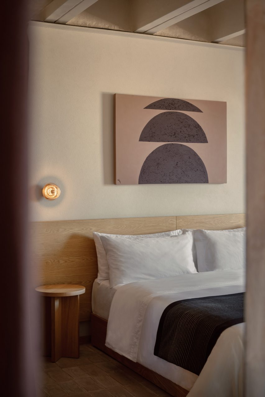 A bedroom with a picture of semi-circles