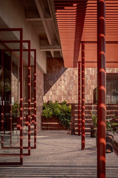 Red door frames open to the outdoors