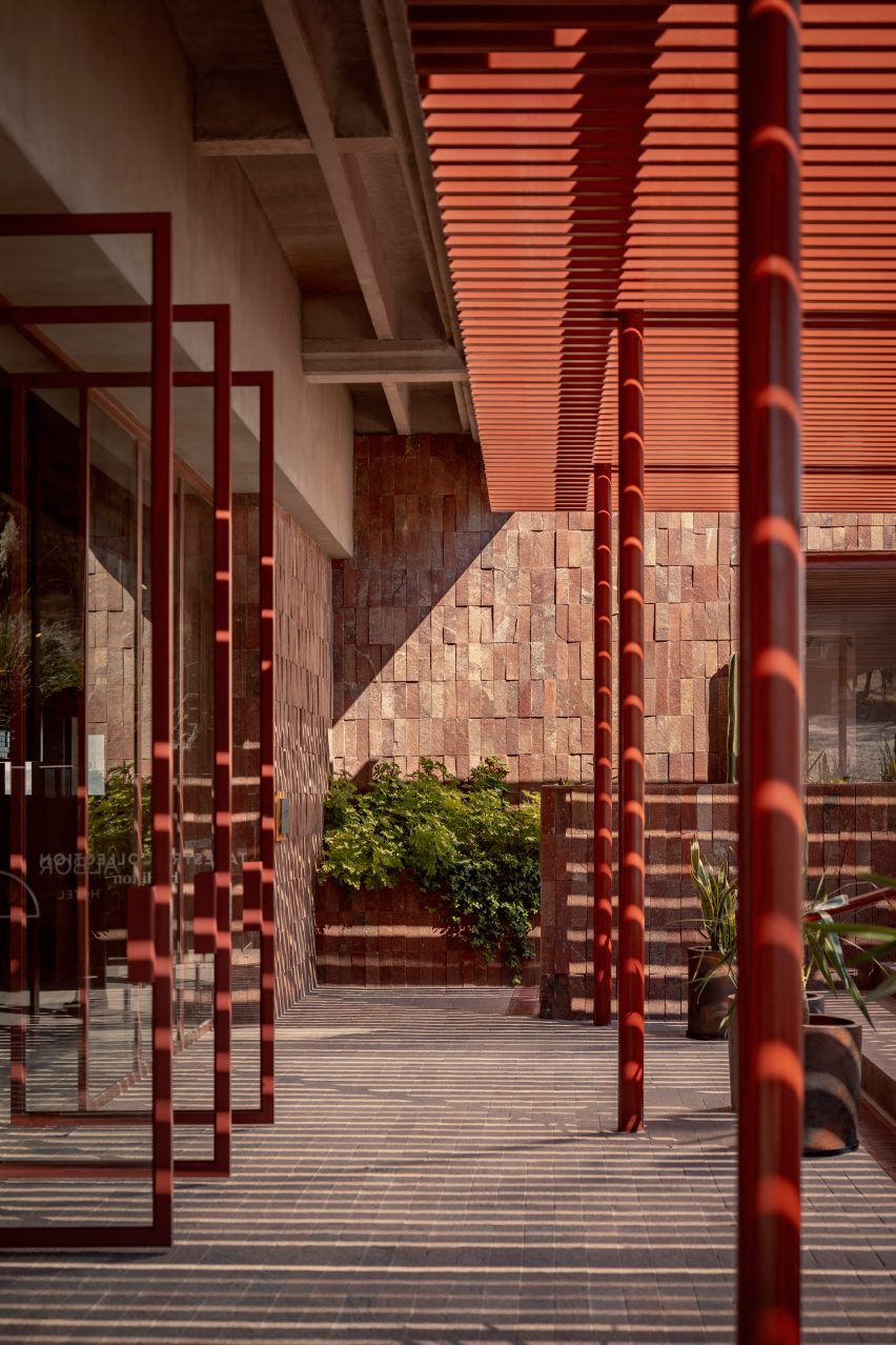 Red door frames open to the outdoors