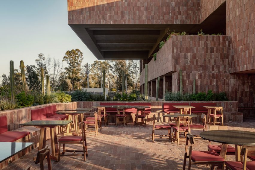 A stone outdoor patio with brick facade