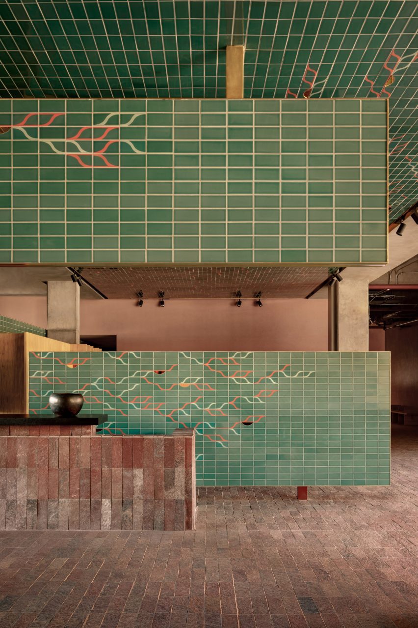 Green tiles with a leaf-like pattern of pink and white
