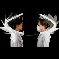 Two people wearing masks for air pollution