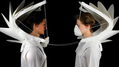 Two people wearing masks for air pollution