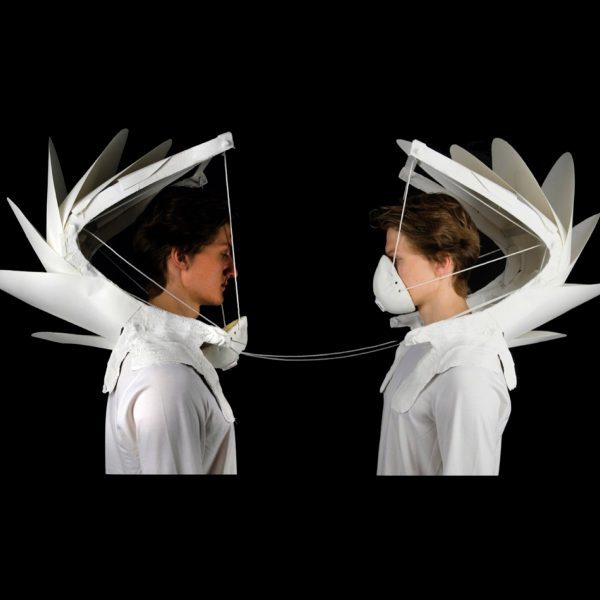 Two people wearing masks for air pollution