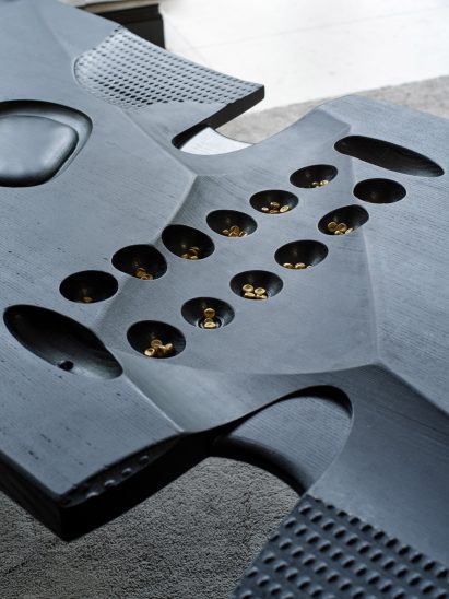 Oware game carved into Interplay bench by Giles Nartey 