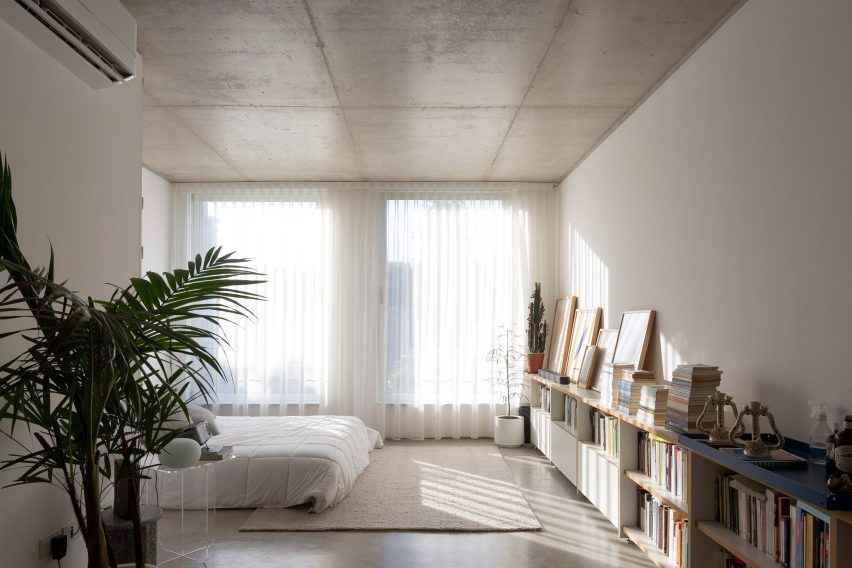 Concrete bedroom at Virrey Aviles Street apartments by Juan Campanini and Josefina Sposito