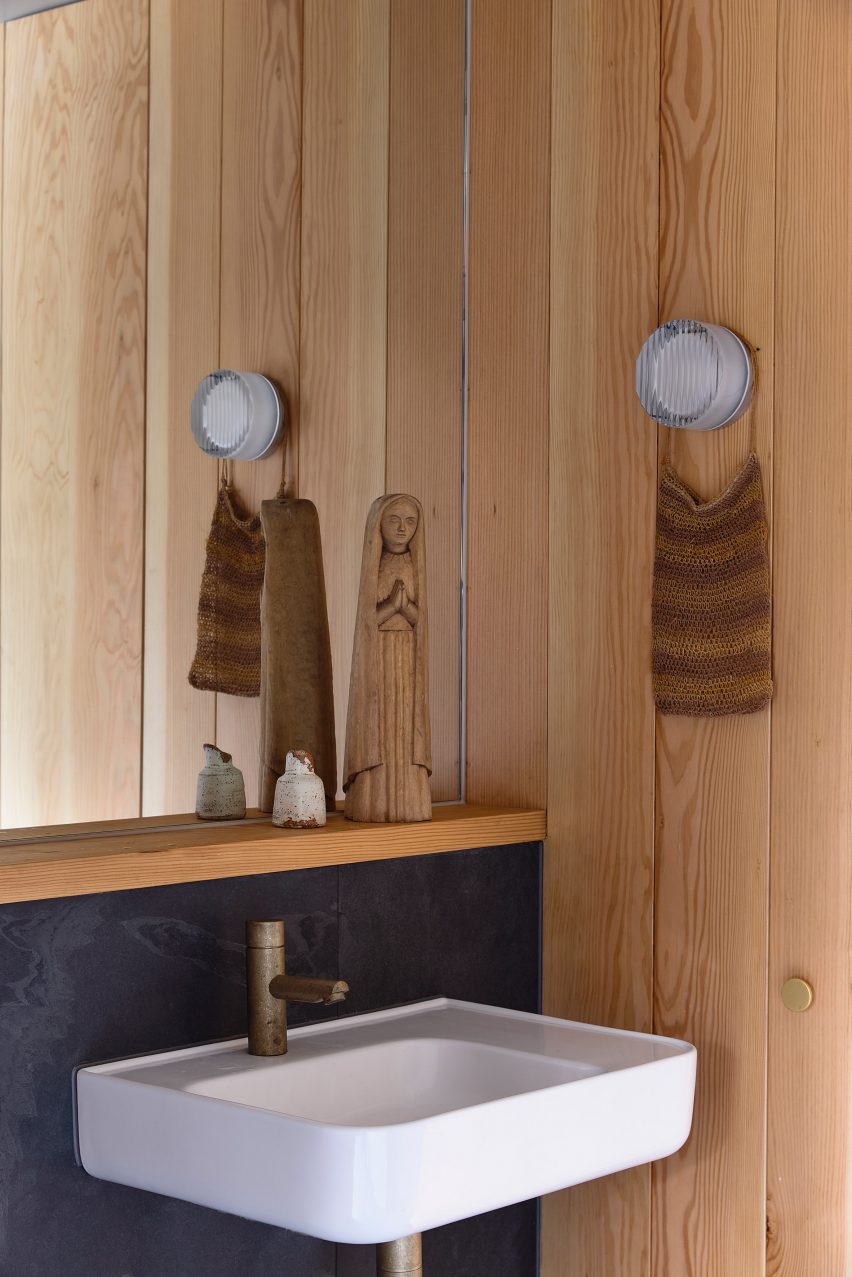 White sink in a timber bathroom