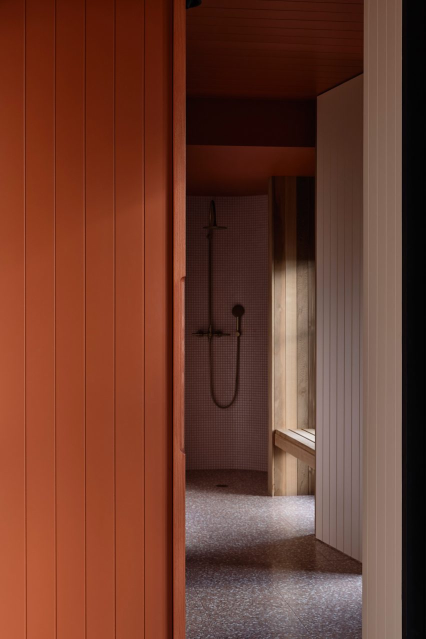 Walk-in shower with terracotta timber walls