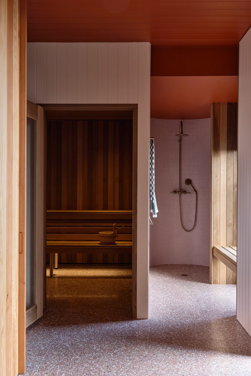 Pink and terracotta-toned walk-in shower room