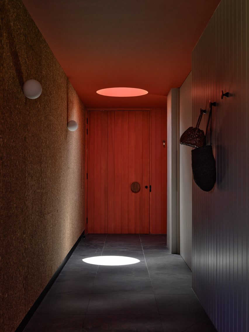 Corridor with a red door and oculus