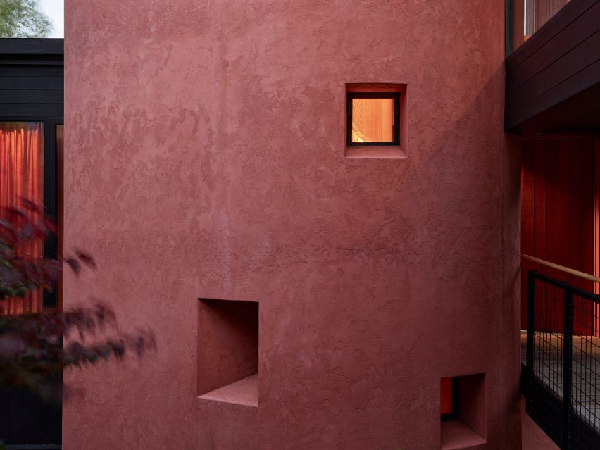 Rounded red render structure with square windows