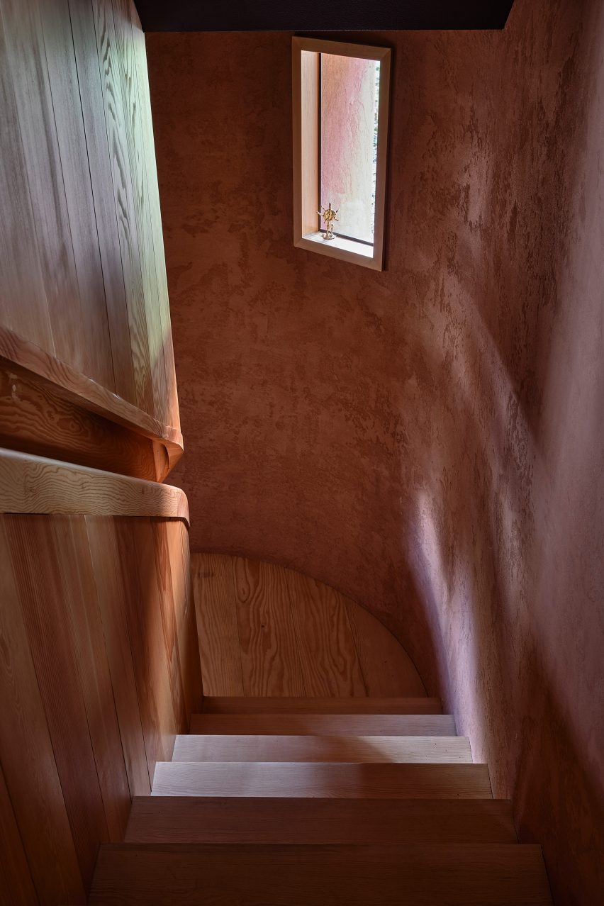 Stairwell in a rounded ochre-rendered structure