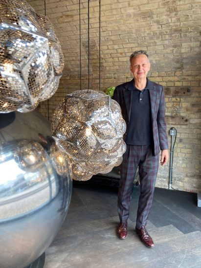 Tom Dixon with his creations at the Hypermobile exhibition at Coal Drops Yard in King's Cross