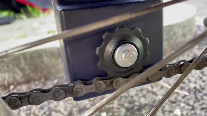 Gear on back of MyPowerbank by Luke Talbot sat on top of a bike chain