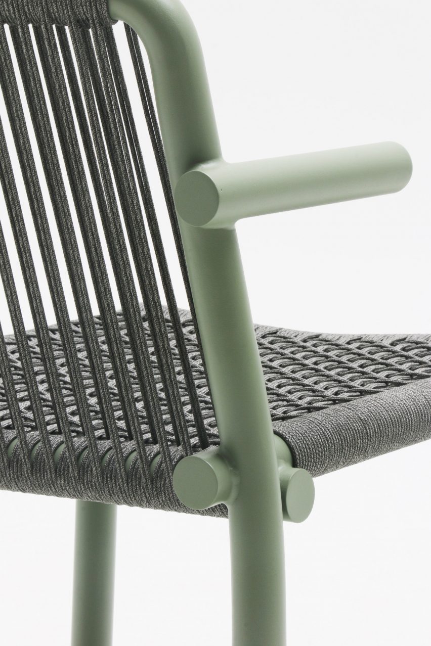 Photograph of khaki green chair on white backdrop