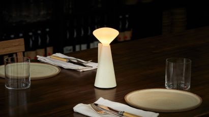 Lamp on table in dimly-lit restaurant
