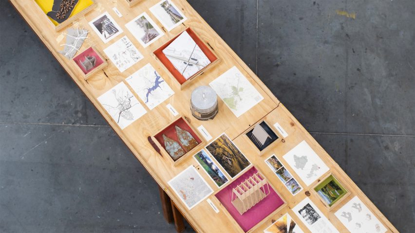 a photograph from above of a table with multiple student projects on it
