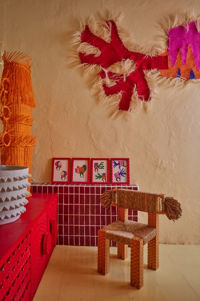 Plaster walls with red, orange and brown designs in front