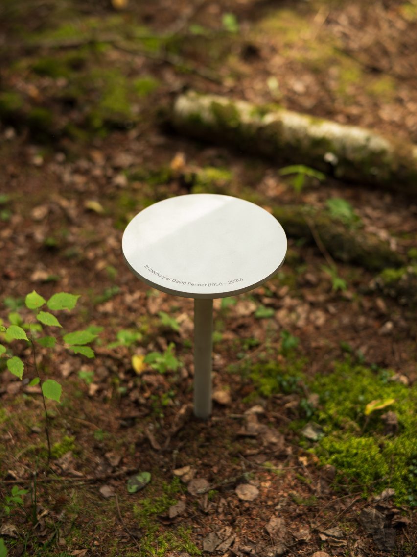 A small circular stool sitting in a forest