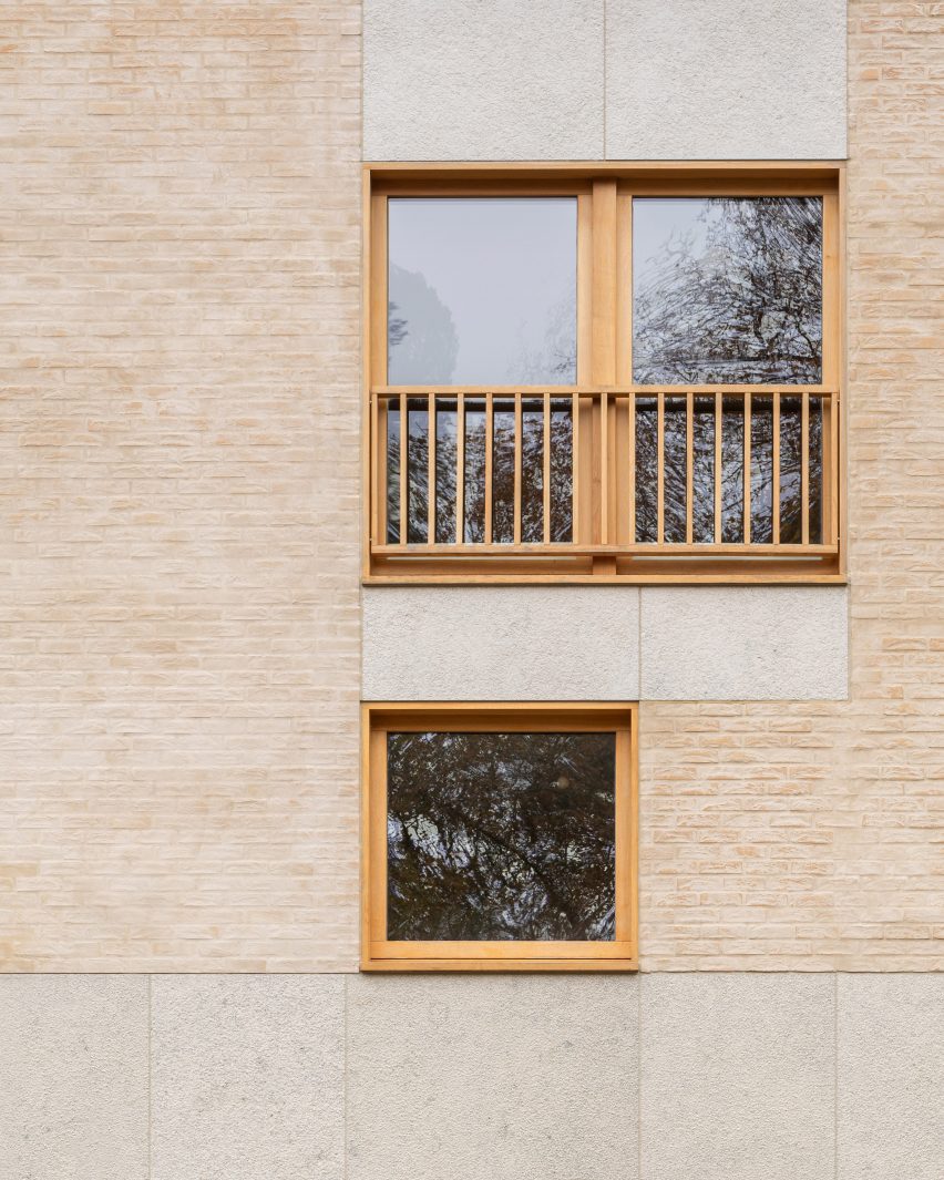 Brick home exterior with wood-framed windows