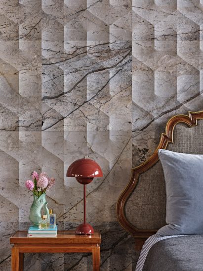 Bedside table against marble wall