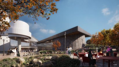 A black wedge shaped building interlocked with the white geometric building