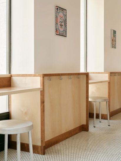Window front with counter seating in Sando burger restaurant