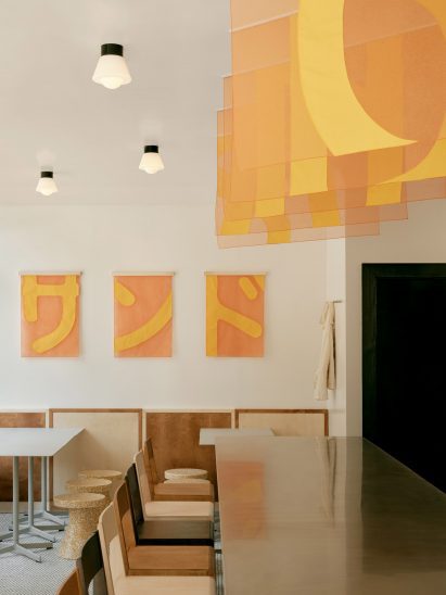 Counter seating in restaurant in Geneva by Sapid Studio