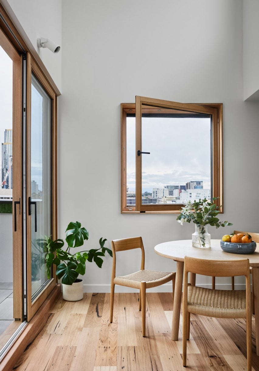 Wooden dining area with wood-framed windows