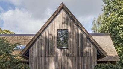 Wood-clad gable end of the extension at Villa VD by Britsom Philips