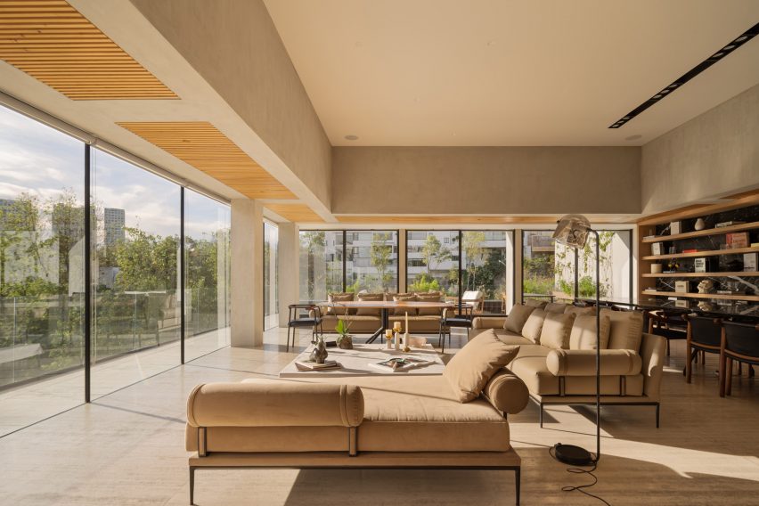 Living room at Casa Madre by Taller David Dana with floor to ceiling windows