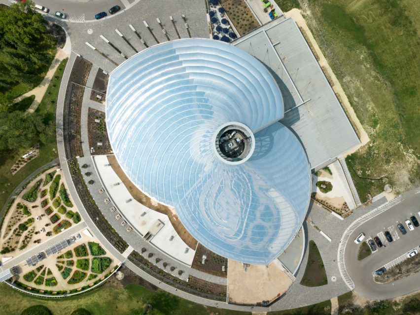A building with a shell-like roof