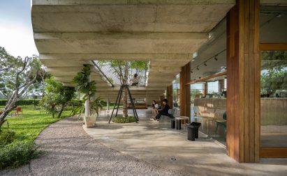 Dining space beneath The Pomelo Amphawa Cafe by Looklen Architects