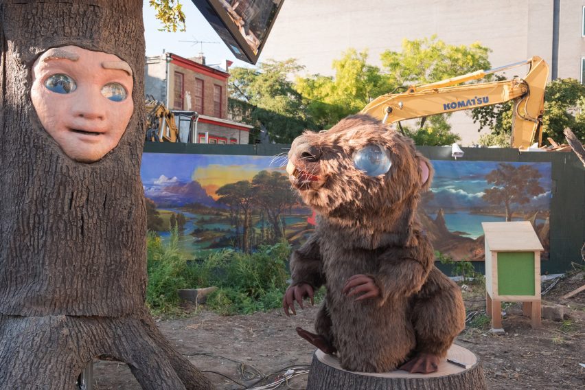 A large animatronic beaver and tree