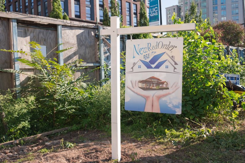 A real estate sign branded with New Red Order