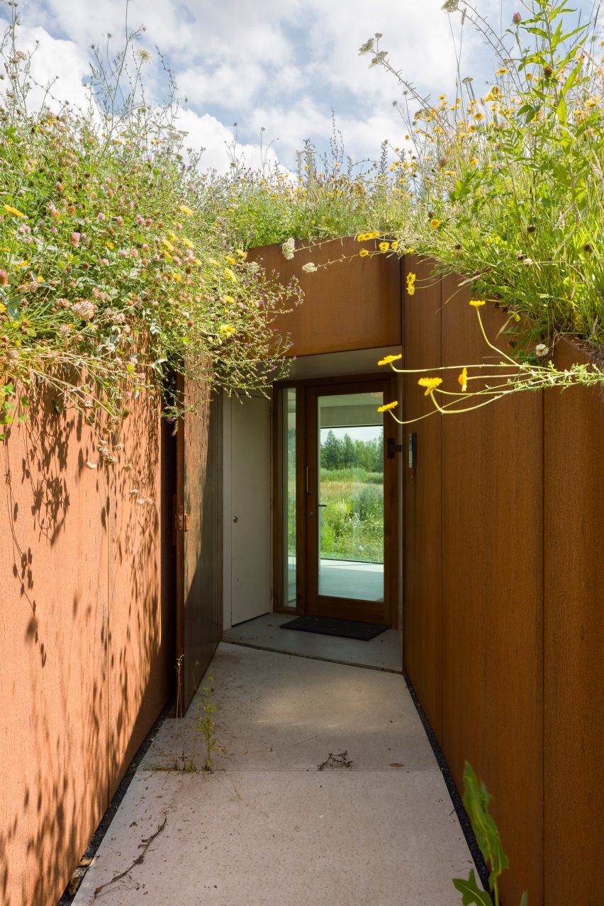 Entrance to The Under The Ground House through a grassy mound