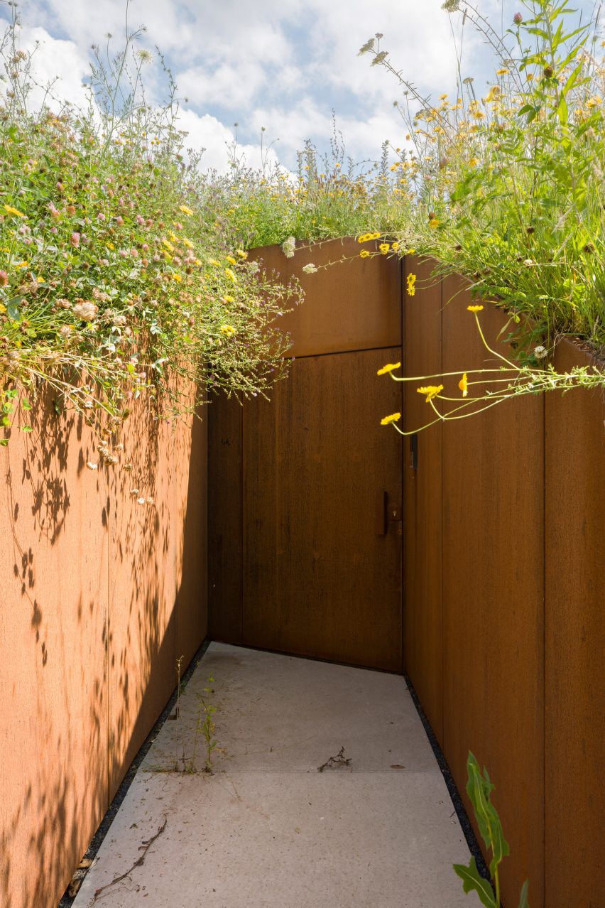 Entrance to The Under The Ground House through a grassy mound